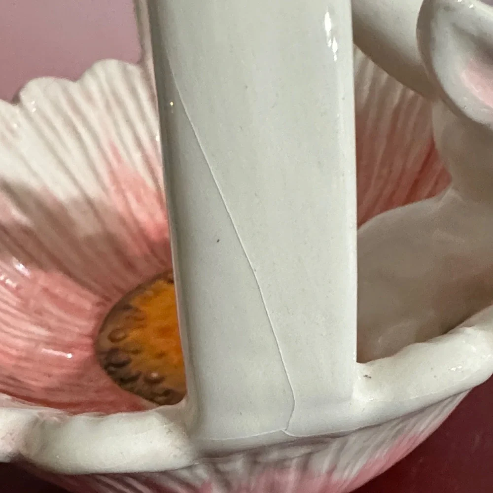 Vintage Ceramic bunny basket with a pink bow and floral motif